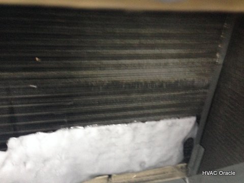 Image of evaporator coil with ice formed on the bottom thrid
